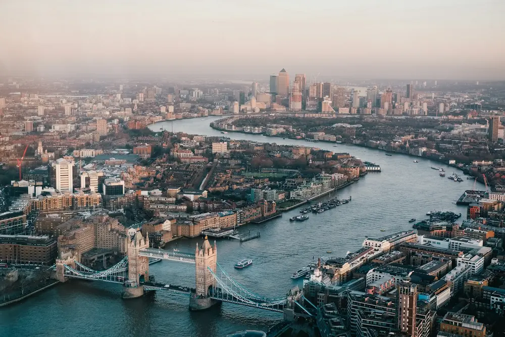 The River Thames winding through the City of London at first light